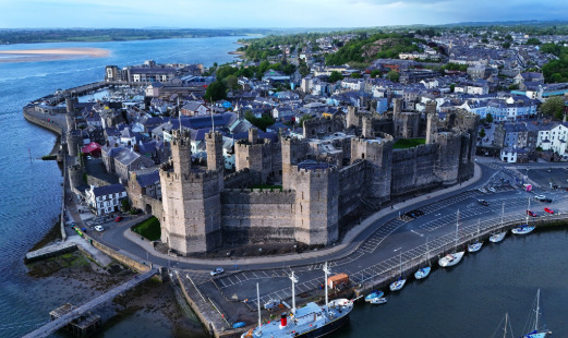 Aerial view of Caernarfon Castle's towers and walls